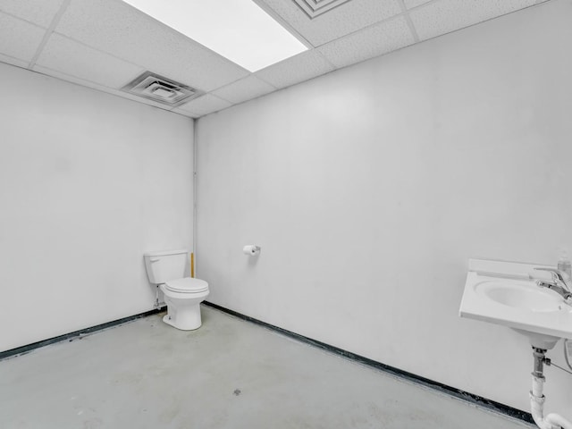 bathroom with visible vents, a paneled ceiling, and toilet