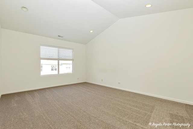 spare room featuring recessed lighting, baseboards, vaulted ceiling, and carpet floors