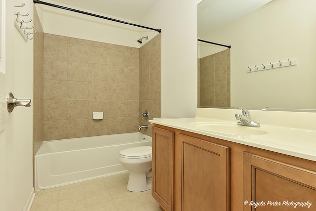 bathroom with tile patterned floors, vanity, shower / bathing tub combination, and toilet
