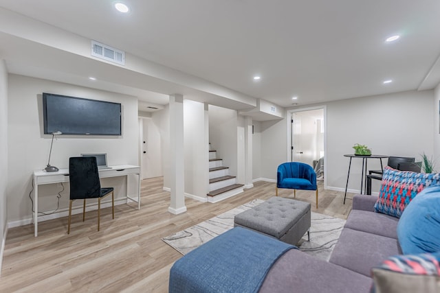 living room featuring baseboards, recessed lighting, stairs, visible vents, and wood finished floors