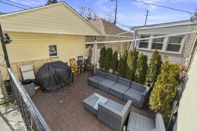view of patio with grilling area and an outdoor hangout area