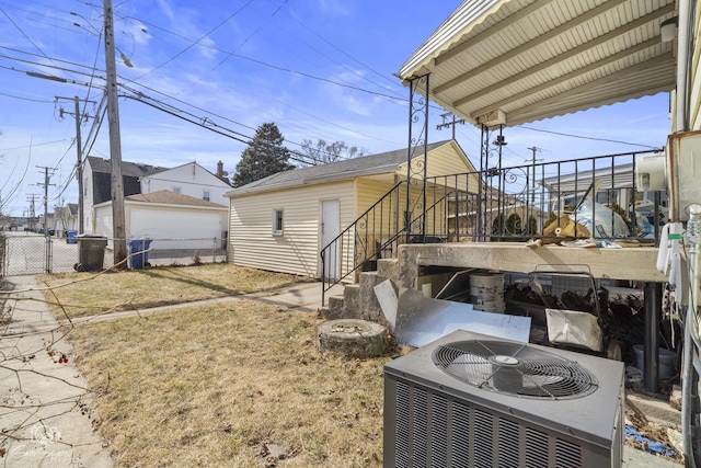exterior space featuring fence and cooling unit