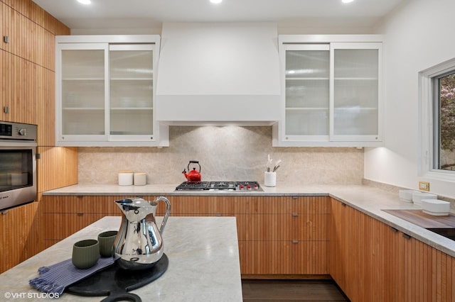 1333 N Bell Ave, Chicago, IL 60622 - kitchen featuring appliances with stainless steel finishes, decorative backsplash, glass insert cabinets, recessed lighting, and modern cabinets