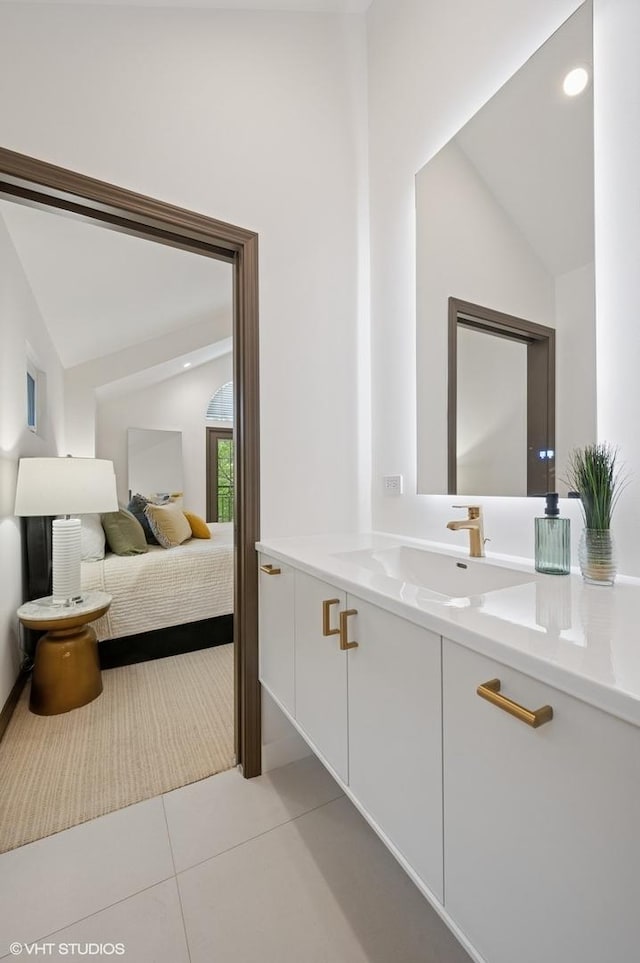 1333 N Bell Ave, Chicago, IL 60622 - bathroom featuring lofted ceiling, tile patterned floors, and vanity