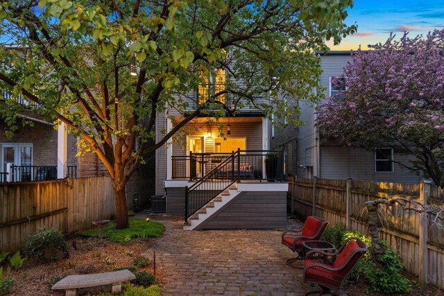 1333 N Bell Ave, Chicago, IL 60622 - back of property featuring a patio, a fenced backyard, stairway, and central air condition unit