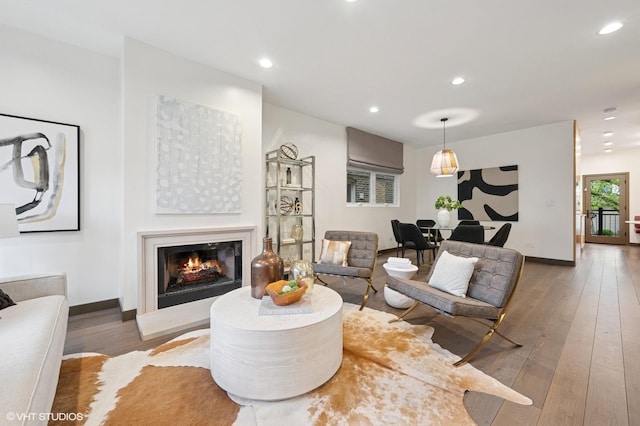 1333 N Bell Ave, Chicago, IL 60622 - living area with recessed lighting, a warm lit fireplace, hardwood / wood-style floors, and baseboards