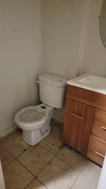 15622 Millard Ave, Markham, IL 60428 - half bath with toilet, tile patterned floors, and vanity