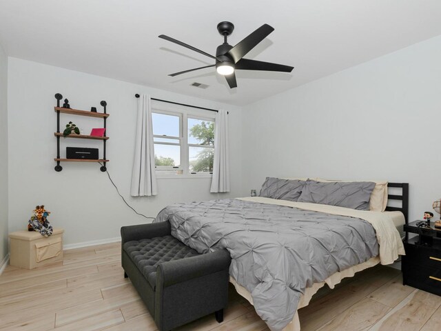 11554 S Neenah Ave, Worth, IL 60482 - bedroom featuring light wood-style flooring, a ceiling fan, and baseboards