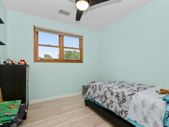 11554 S Neenah Ave, Worth, IL 60482 - bedroom with light wood finished floors, baseboards, and a ceiling fan