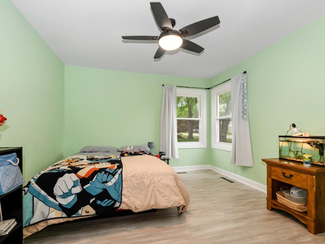 11554 S Neenah Ave, Worth, IL 60482 - bedroom featuring wood finished floors, baseboards, and a ceiling fan
