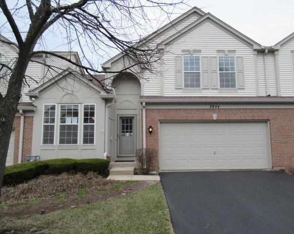 2844 Waterfront Ave, Algonquin, IL 60102 - view of front facade with brick siding, driveway, and a garage