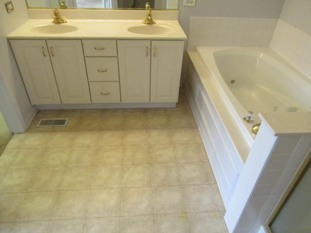 2844 Waterfront Ave, Algonquin, IL 60102 - full bath featuring double vanity, a jetted tub, visible vents, and a sink