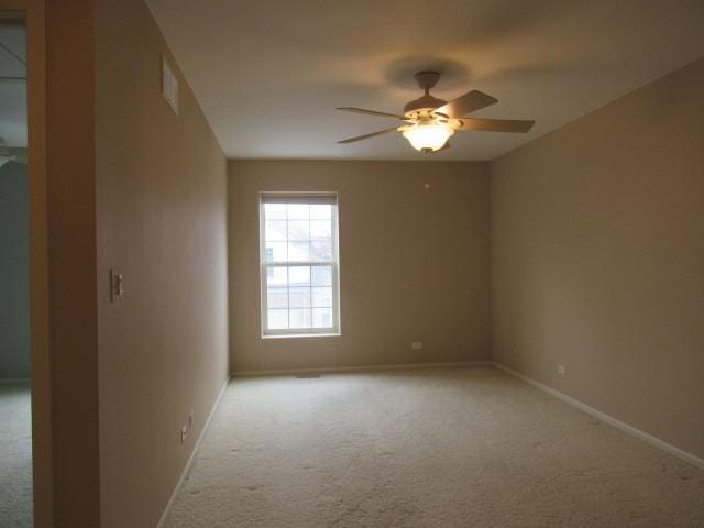 2844 Waterfront Ave, Algonquin, IL 60102 - unfurnished room with light colored carpet, baseboards, and a ceiling fan