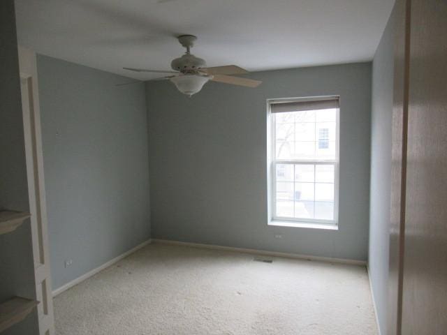 2844 Waterfront Ave, Algonquin, IL 60102 - spare room with baseboards, a ceiling fan, and light colored carpet