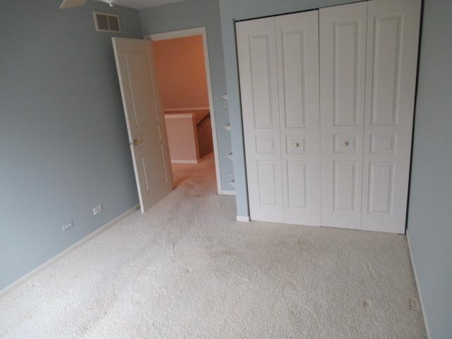 2844 Waterfront Ave, Algonquin, IL 60102 - unfurnished bedroom with a closet, carpet flooring, baseboards, and visible vents