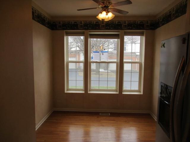 2844 Waterfront Ave, Algonquin, IL 60102 - unfurnished dining area with baseboards, a ceiling fan, visible vents, and hardwood / wood-style flooring