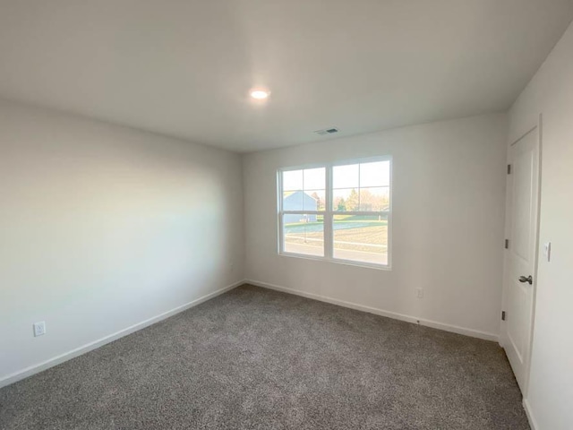 2011 Winterberry Trl, Wonder Lake, IL 60097 - spare room featuring visible vents, baseboards, and carpet