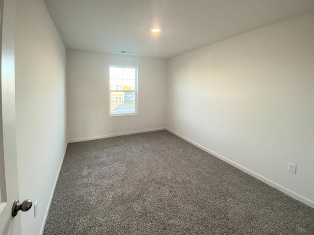 2011 Winterberry Trl, Wonder Lake, IL 60097 - carpeted spare room featuring visible vents and baseboards