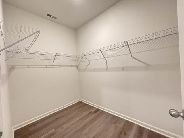 2011 Winterberry Trl, Wonder Lake, IL 60097 - spacious closet featuring visible vents and dark wood-style floors