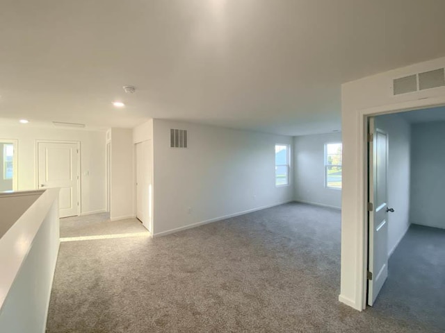 2011 Winterberry Trl, Wonder Lake, IL 60097 - carpeted spare room featuring baseboards and visible vents