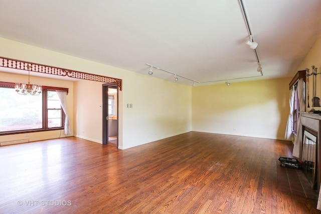 1226 Strieff Ln, Flossmoor, IL 60422 - unfurnished living room with rail lighting, a chandelier, and wood finished floors