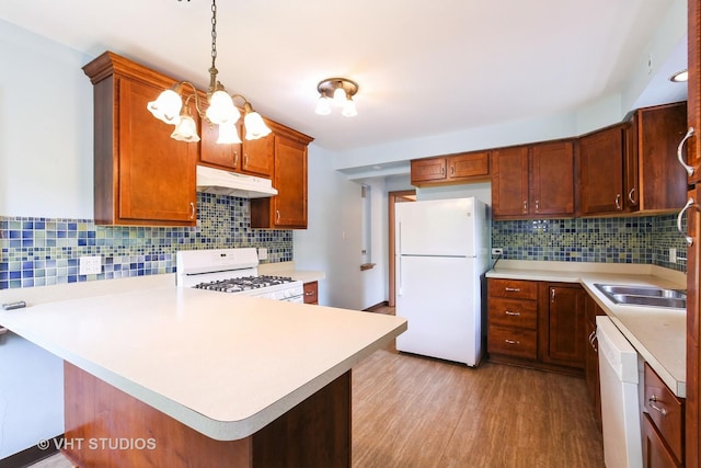 1226 Strieff Ln, Flossmoor, IL 60422 - kitchen with white appliances, under cabinet range hood, decorative backsplash, and light wood-type flooring