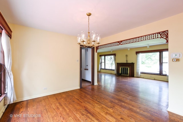 1226 Strieff Ln, Flossmoor, IL 60422 - unfurnished living room featuring a chandelier, wood finished floors, a fireplace, and a baseboard radiator