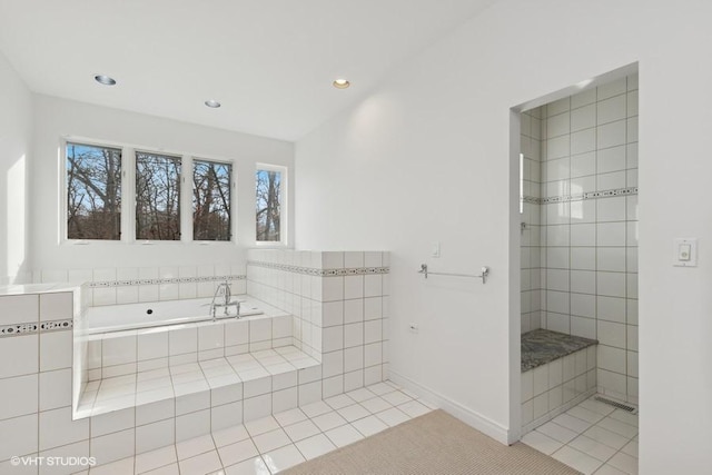 bathroom featuring baseboards, a tile shower, recessed lighting, tile patterned floors, and a garden tub