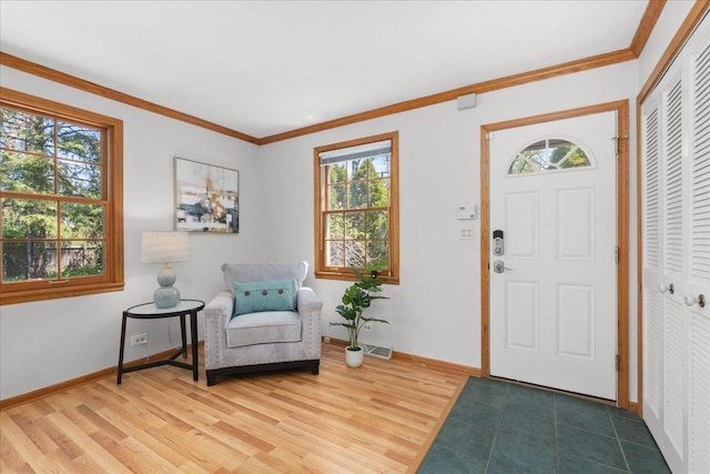 1945 Bosworth Ln, Northfield, IL 60093 - foyer entrance featuring healthy amount of natural light, wood finished floors, baseboards, and crown molding