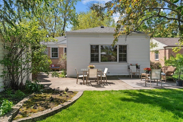 1945 Bosworth Ln, Northfield, IL 60093 - rear view of property with a patio area and a lawn
