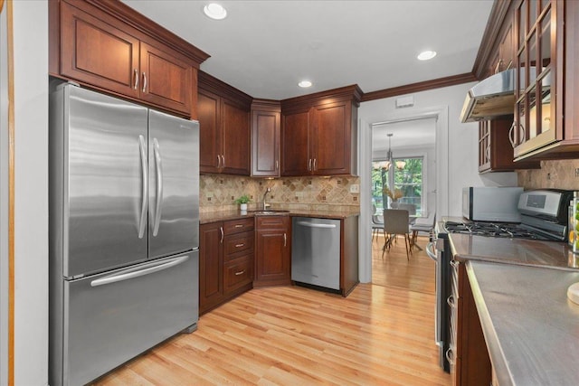 1945 Bosworth Ln, Northfield, IL 60093 - kitchen featuring stainless steel appliances, a sink, light wood finished floors, backsplash, and recessed lighting