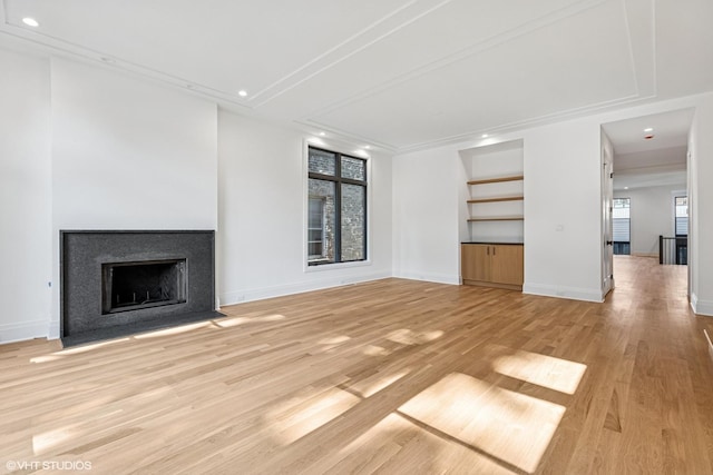 3846 N Bell Ave, Chicago, IL 60618 - unfurnished living room with light wood-type flooring, recessed lighting, and a fireplace with flush hearth