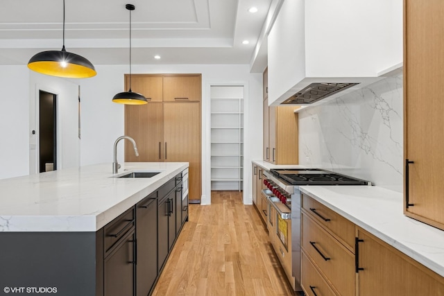3846 N Bell Ave, Chicago, IL 60618 - kitchen with double oven range, custom exhaust hood, recessed lighting, decorative backsplash, and light stone countertops