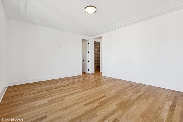 3846 N Bell Ave, Chicago, IL 60618 - spare room with light wood finished floors and baseboards