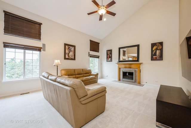 1641 Foster Cir, Algonquin, IL 60102 - living area featuring light carpet, high vaulted ceiling, a fireplace with flush hearth, ceiling fan, and baseboards