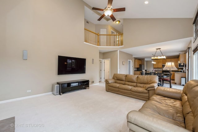 1641 Foster Cir, Algonquin, IL 60102 - living area with ceiling fan, light carpet, baseboards, a high ceiling, and a chandelier