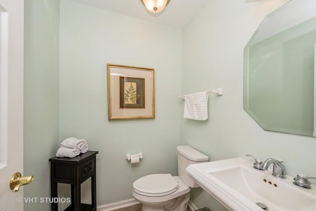 1641 Foster Cir, Algonquin, IL 60102 - half bath featuring a sink, toilet, and baseboards