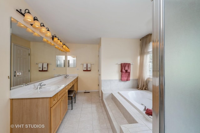 1641 Foster Cir, Algonquin, IL 60102 - full bathroom featuring double vanity, a garden tub, tile patterned floors, and baseboards