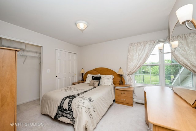 1641 Foster Cir, Algonquin, IL 60102 - bedroom with light carpet, two closets, and baseboards