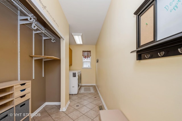 1641 Foster Cir, Algonquin, IL 60102 - washroom featuring cabinet space, light tile patterned floors, washing machine and clothes dryer, and baseboards