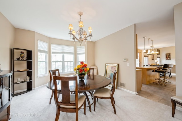 1641 Foster Cir, Algonquin, IL 60102 - dining space featuring a chandelier, healthy amount of natural light, baseboards, and light colored carpet