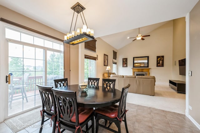1641 Foster Cir, Algonquin, IL 60102 - carpeted dining room with lofted ceiling, ceiling fan, baseboards, tile patterned flooring, and a chandelier