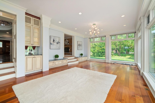 2426 Lexington Dr, Long Grove, IL 60047 - living room featuring a chandelier, ornamental molding, wood finished floors, and recessed lighting