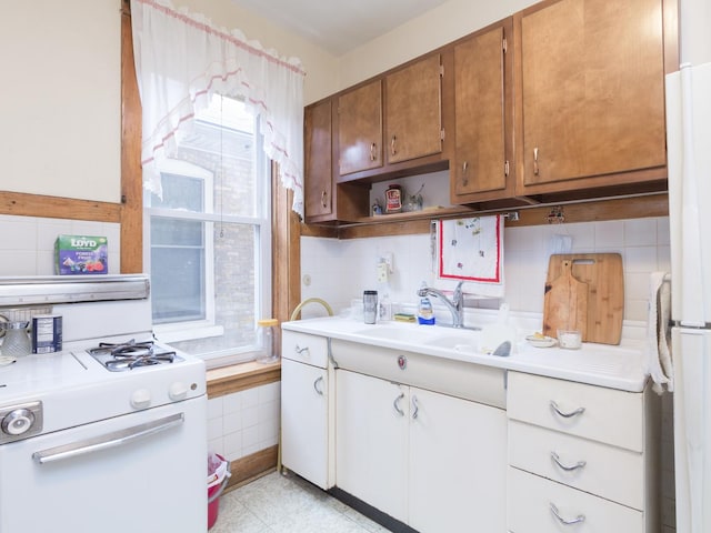 4249 W Melrose St, Chicago, IL 60641 - kitchen with white appliances, light countertops, backsplash, open shelves, and a sink