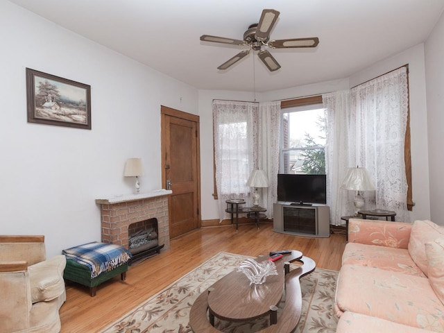 4249 W Melrose St, Chicago, IL 60641 - living area featuring wood finished floors, a ceiling fan, and a brick fireplace