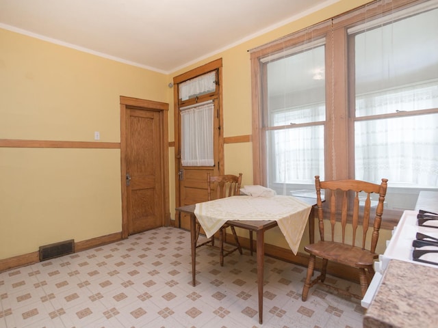 4249 W Melrose St, Chicago, IL 60641 - dining room with visible vents, baseboards, and ornamental molding