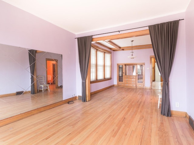 4249 W Melrose St, Chicago, IL 60641 - unfurnished living room featuring a raised ceiling, visible vents, baseboards, and wood finished floors