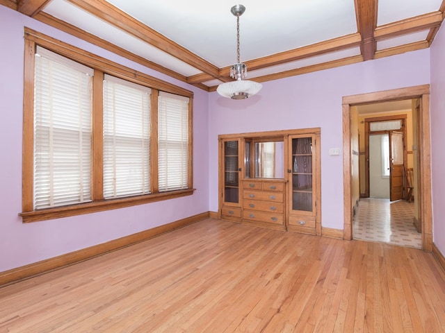 4249 W Melrose St, Chicago, IL 60641 - spare room featuring coffered ceiling, beamed ceiling, light wood finished floors, and baseboards