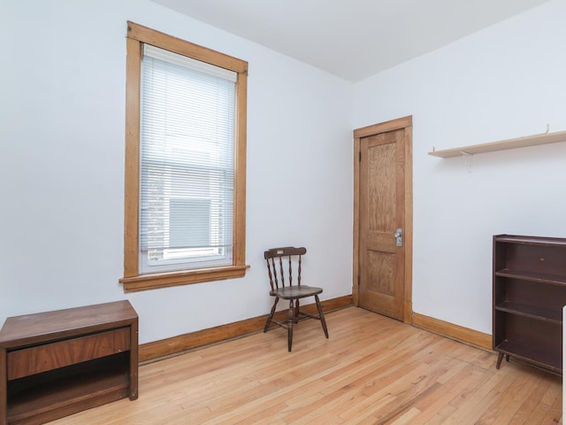 4249 W Melrose St, Chicago, IL 60641 - sitting room with baseboards and light wood-style floors