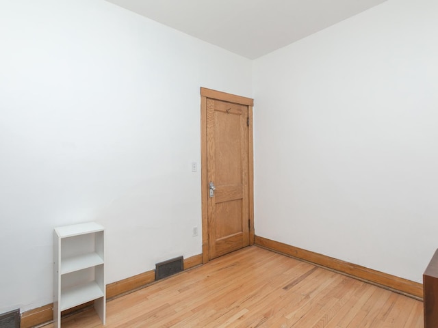 4249 W Melrose St, Chicago, IL 60641 - spare room with visible vents, light wood-style flooring, and baseboards